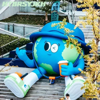 Гигантска надуваема мультяшная кукла Майката Земя заседание на планетата Синя Звезда в шапка с декор за изложения Рекламен реквизит